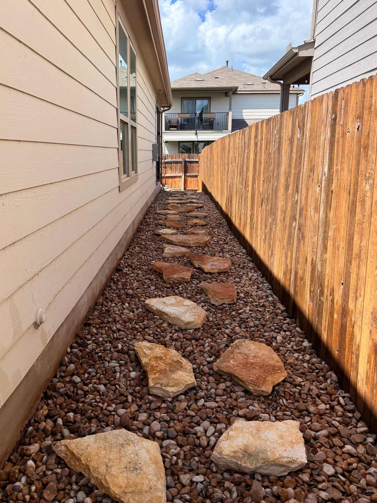 Flagstone stepping path set in river rock